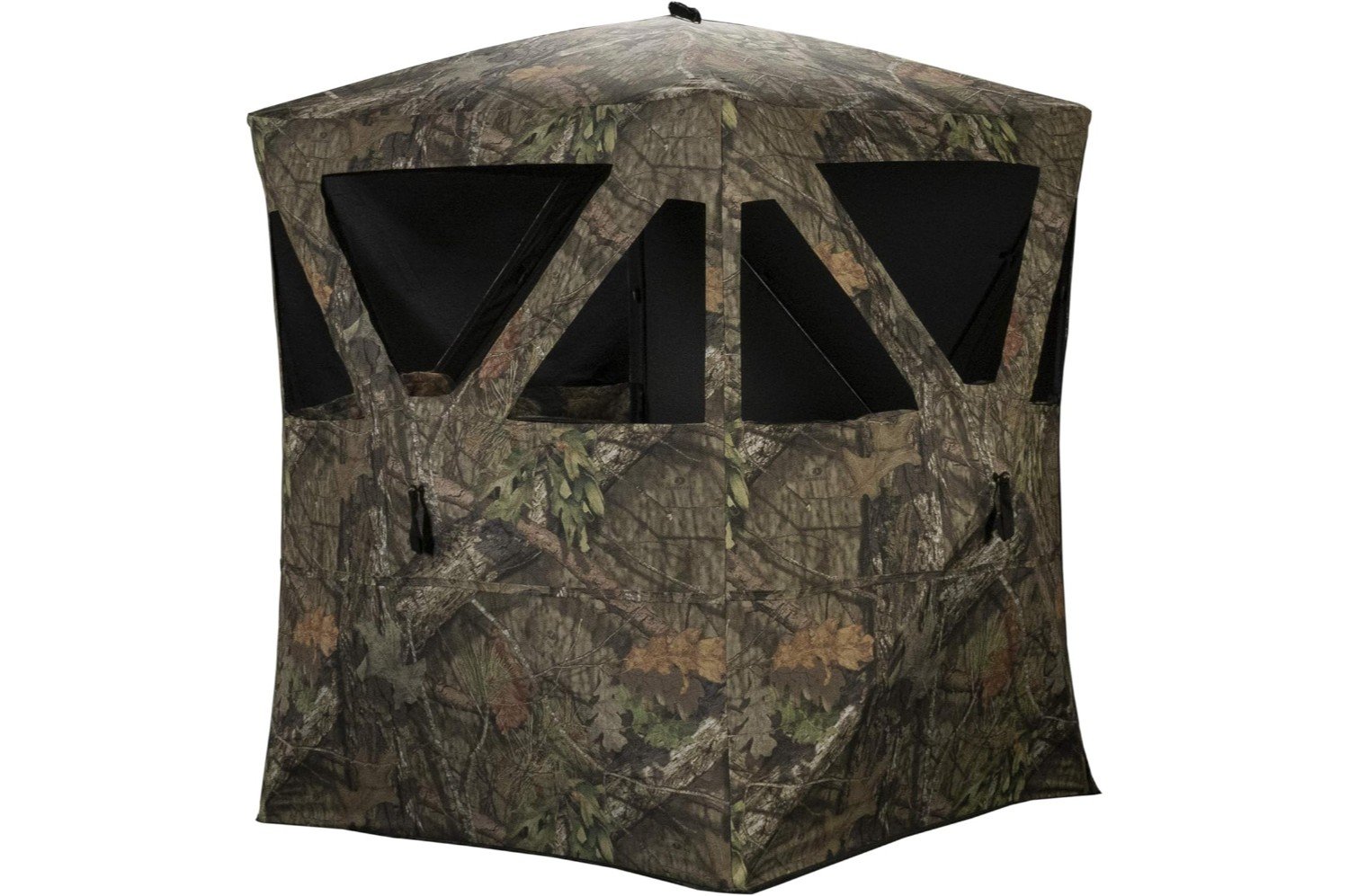 A mobile hunting blind set up in a natural outdoor setting. The blind is camouflaged to blend in with the surrounding environment, providing a concealed area for hunting. The image shows the blind’s structure and its placement among trees and foliage